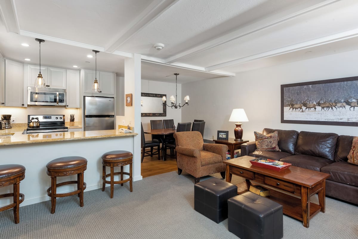 Deluxe Apartment, 2 Bedrooms, Pool Access, Courtyard View | Living area | Flat-screen TV, fireplace