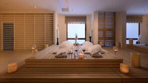 A wooden deck with a table set for two, candles, and wine glasses. - Monte Baia Uludag (Bursa)