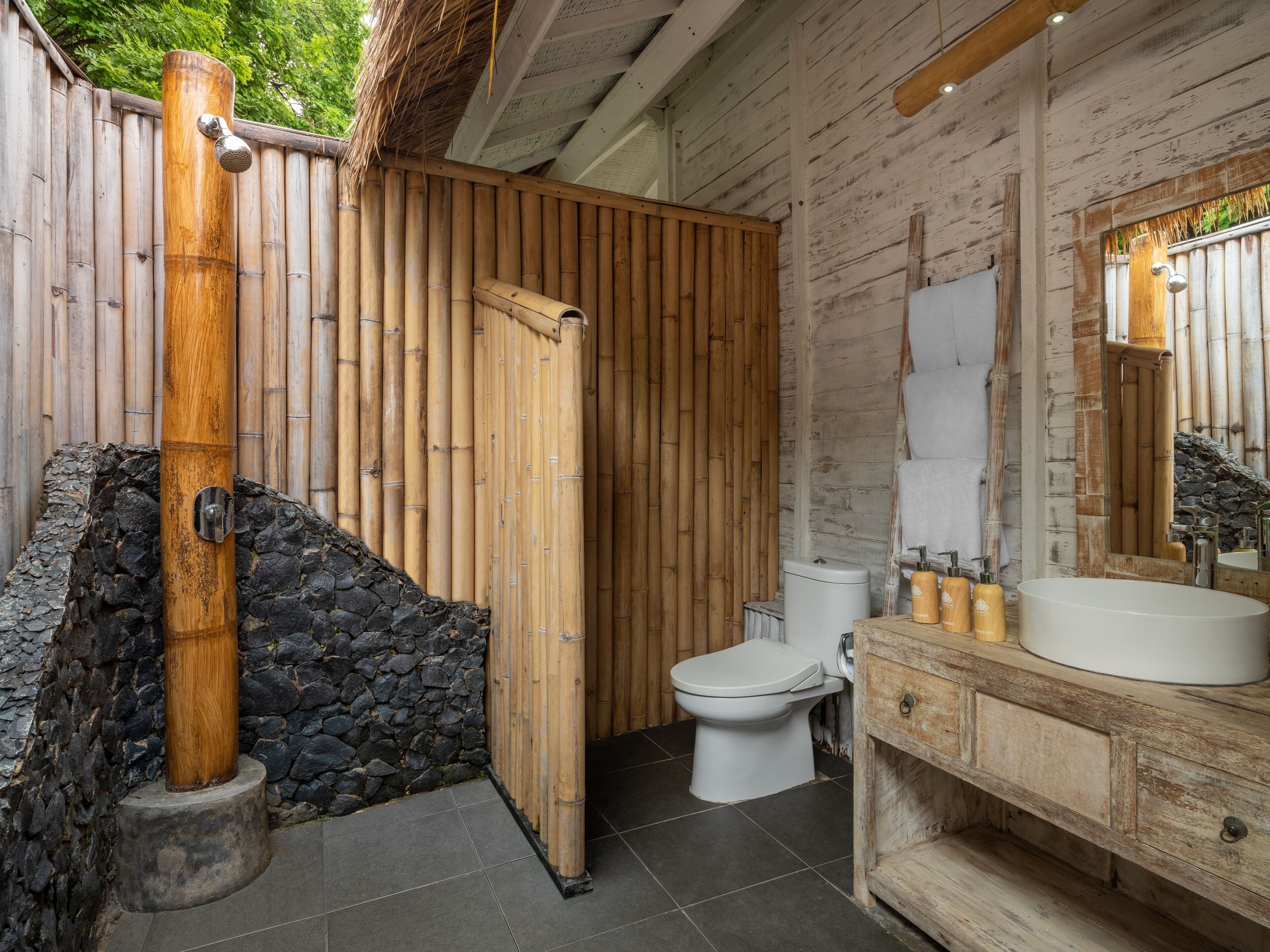 private beach bungalow | bathroom | shower, rainfall showerhead, free toiletries, towels