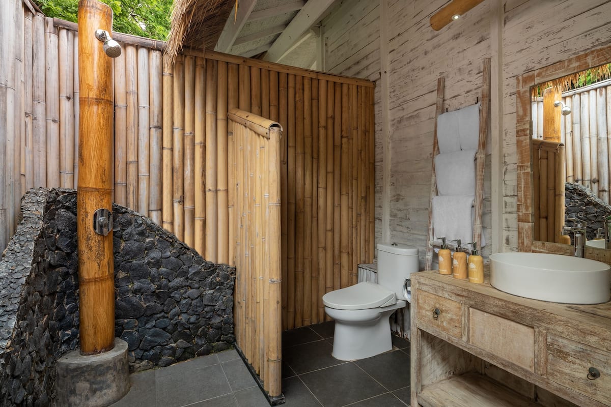 private beach bungalow | bathroom | shower, rainfall showerhead, free toiletries, towels