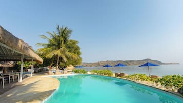 Outdoor pool, open 6:00 AM to 6:00 PM, pool loungers