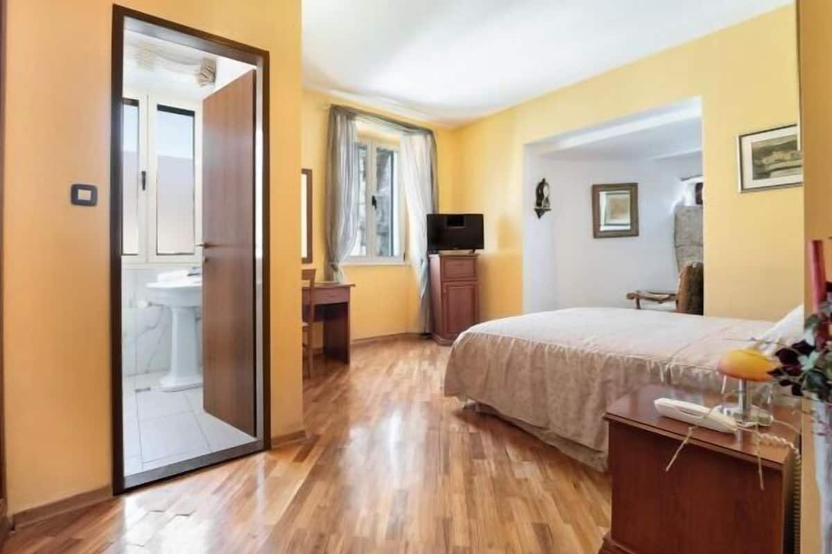 Minibar, desk, blackout curtains, iron/ironing board