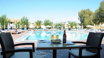 Outdoor pool, open 8 AM to 7 PM, pool umbrellas, pool loungers