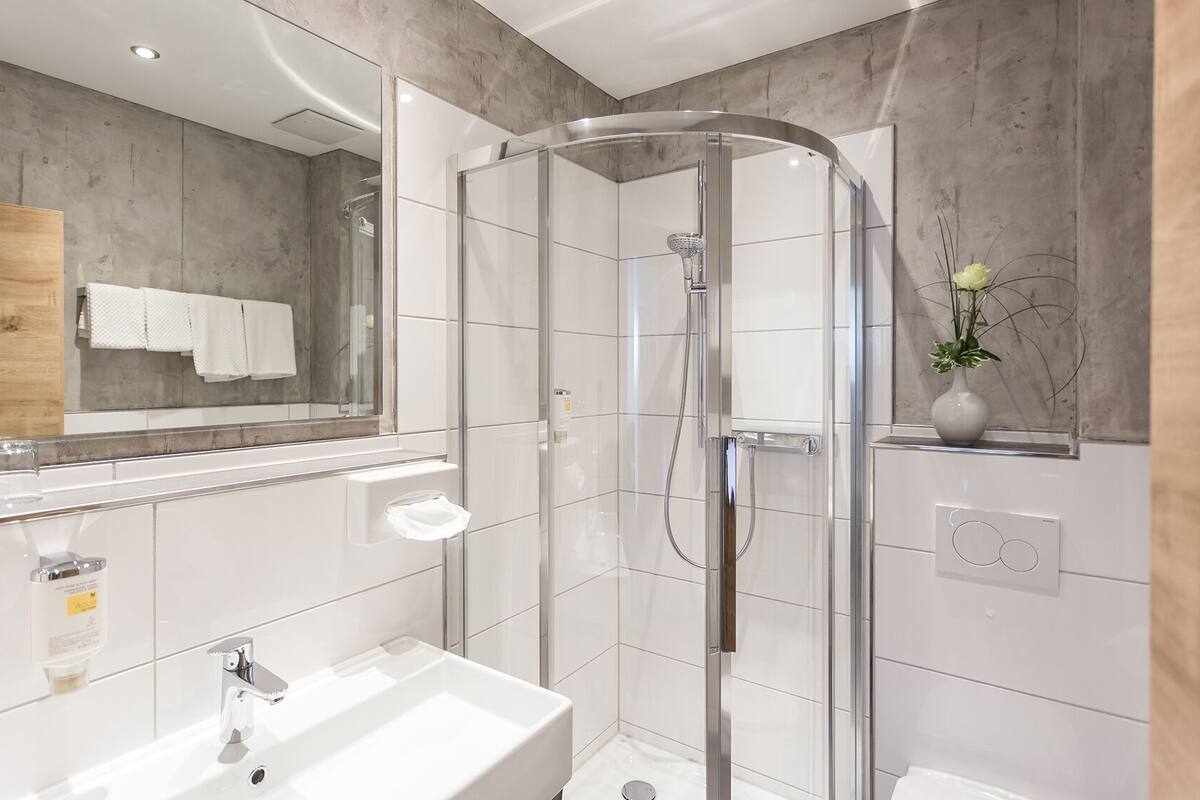 junior suite, 1 bedroom, garden view, mountainside | bathroom | eco-friendly toiletries, hair dryer, towels, soap