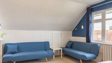 Family Room, Sea View | Individually decorated, individually furnished, iron/ironing board