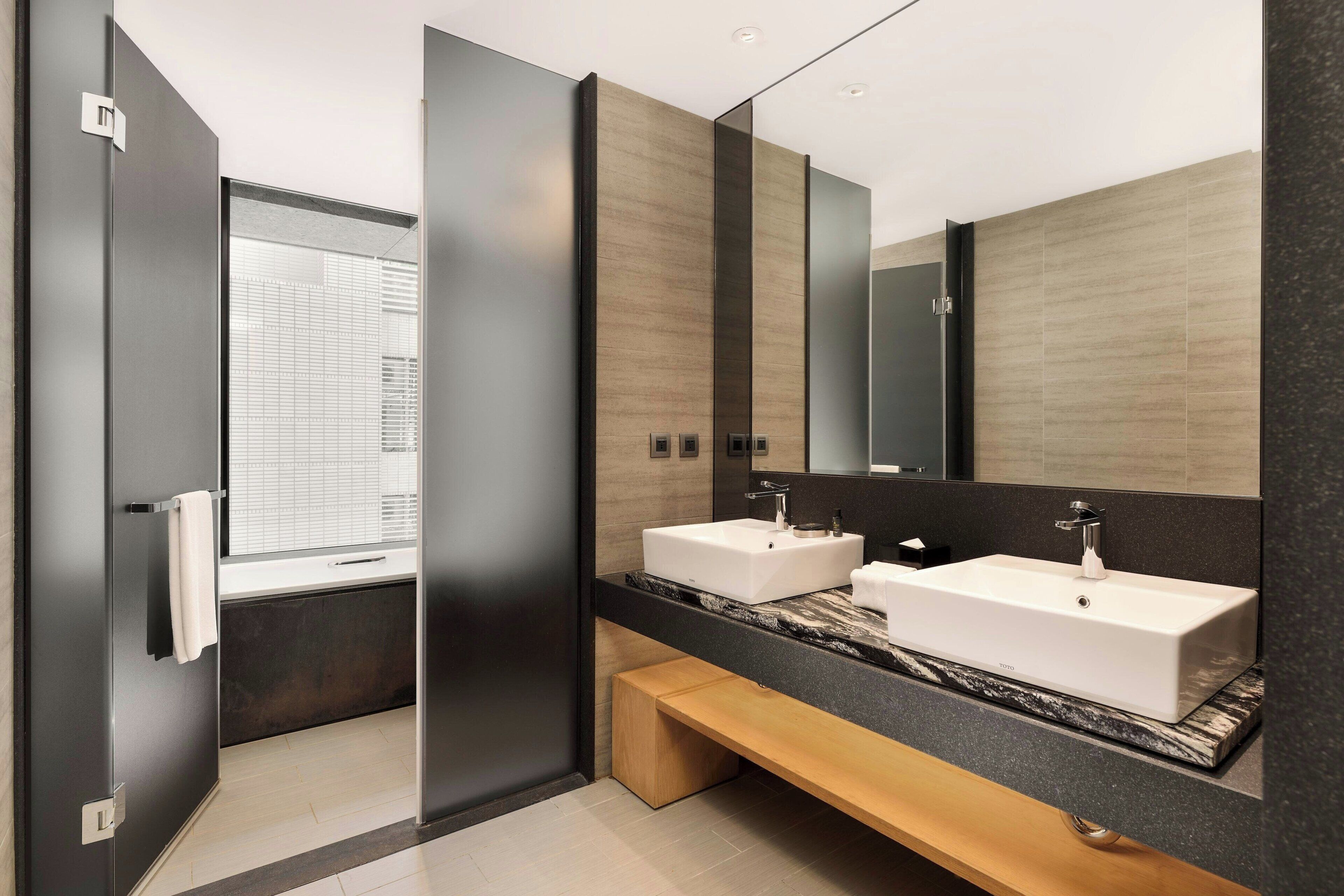 designer toiletries, hair dryer, bathrobes, slippers