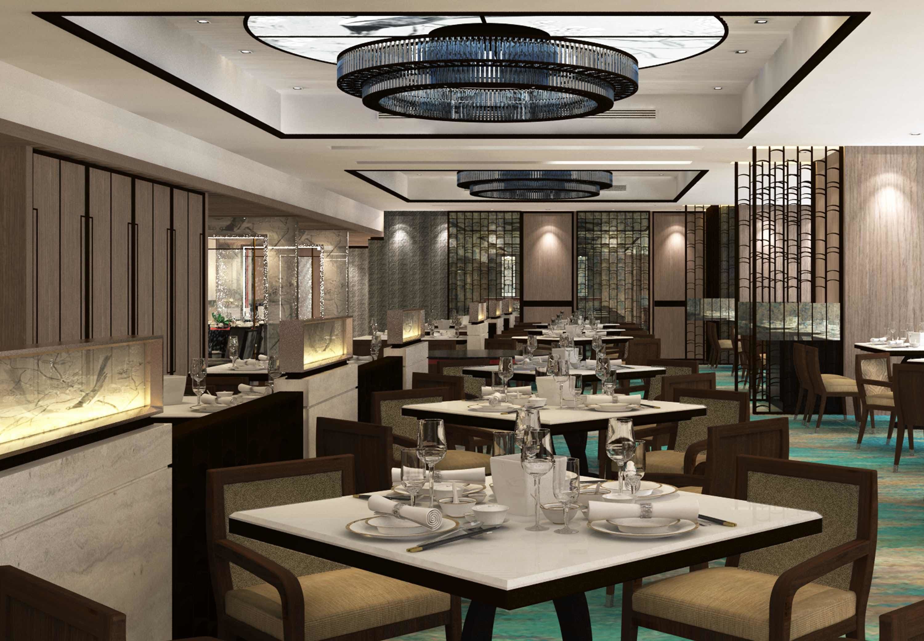 Een modern restaurant met meerdere eettafels, elegante kroonluchters en een stijlvol interieur.