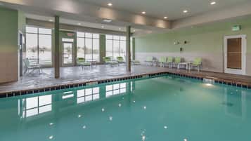 Indoor pool, open 6:00 AM to 11:00 PM, pool loungers