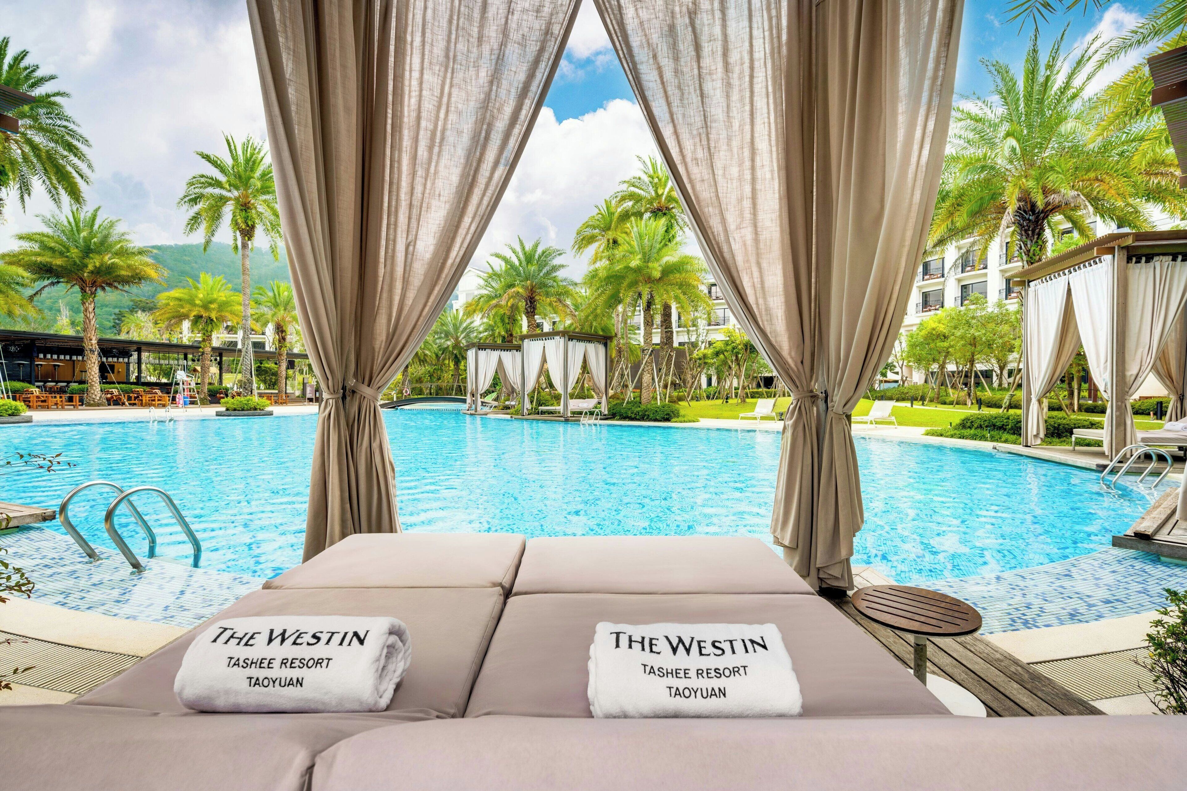 indoor pool, outdoor pool, pool umbrellas, pool loungers