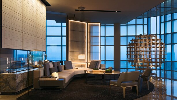 A modern interior with a curved seating area, a glass partition, and a decorative wooden structure. - Shenzhen Marriott Hotel Nanshan (Shenzhen)