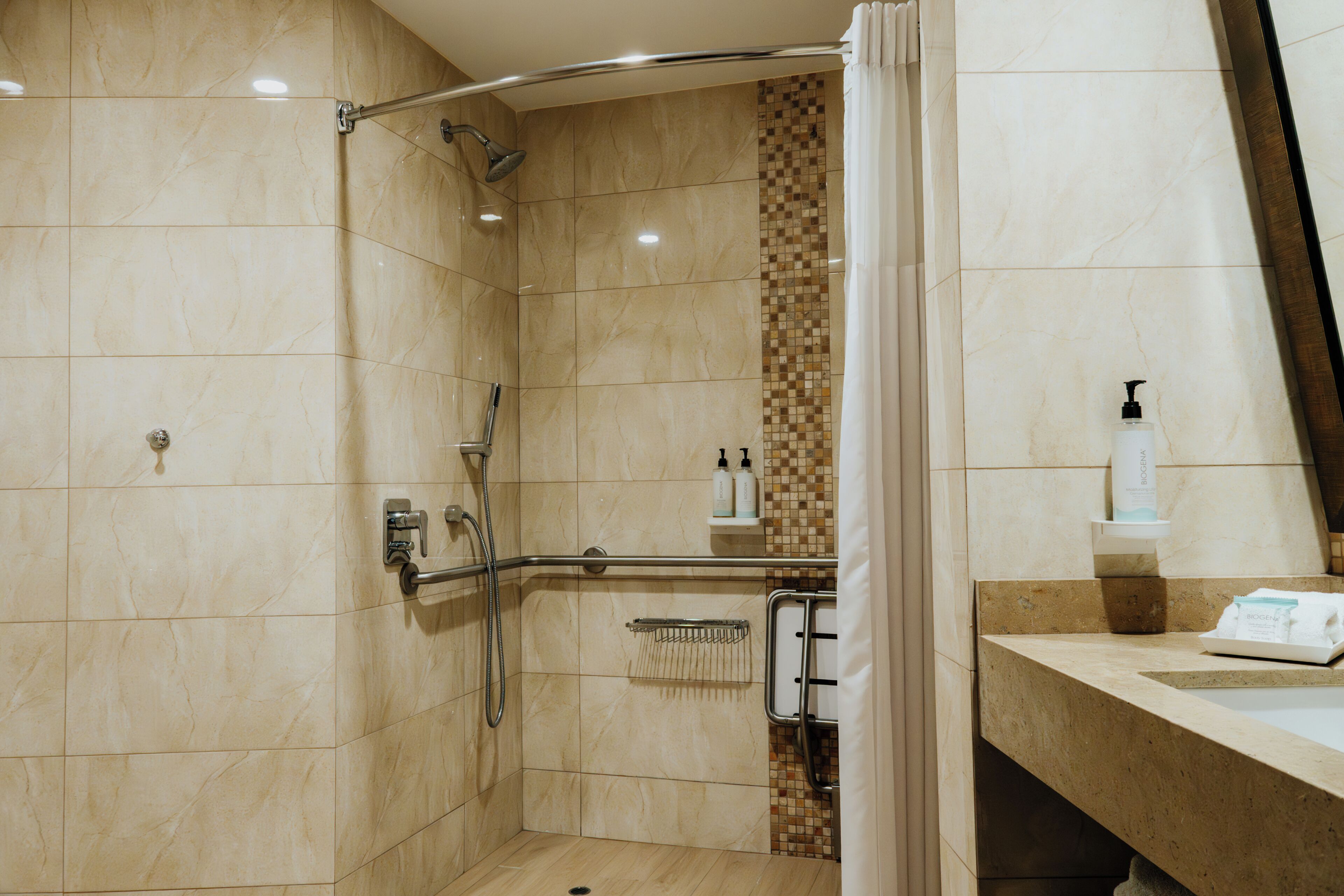 Shower, rainfall showerhead, designer toiletries, towels