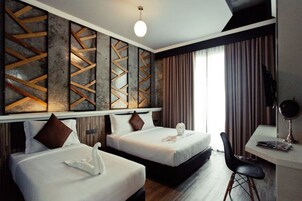 Deluxe Room | Escrivaninha, cortinas blackout, Wi-Fi de cortesia