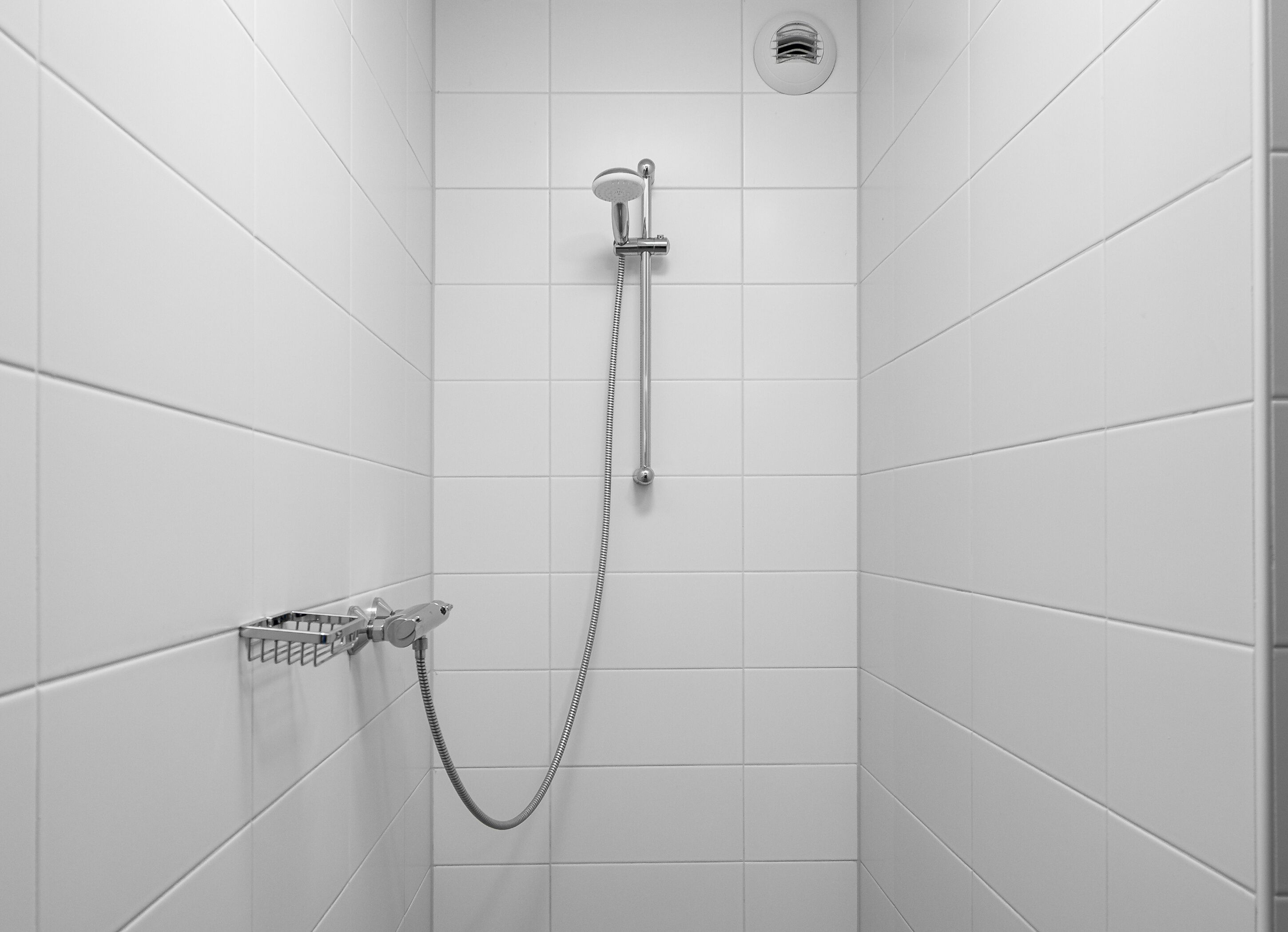 shower, designer toiletries, hair dryer, towels