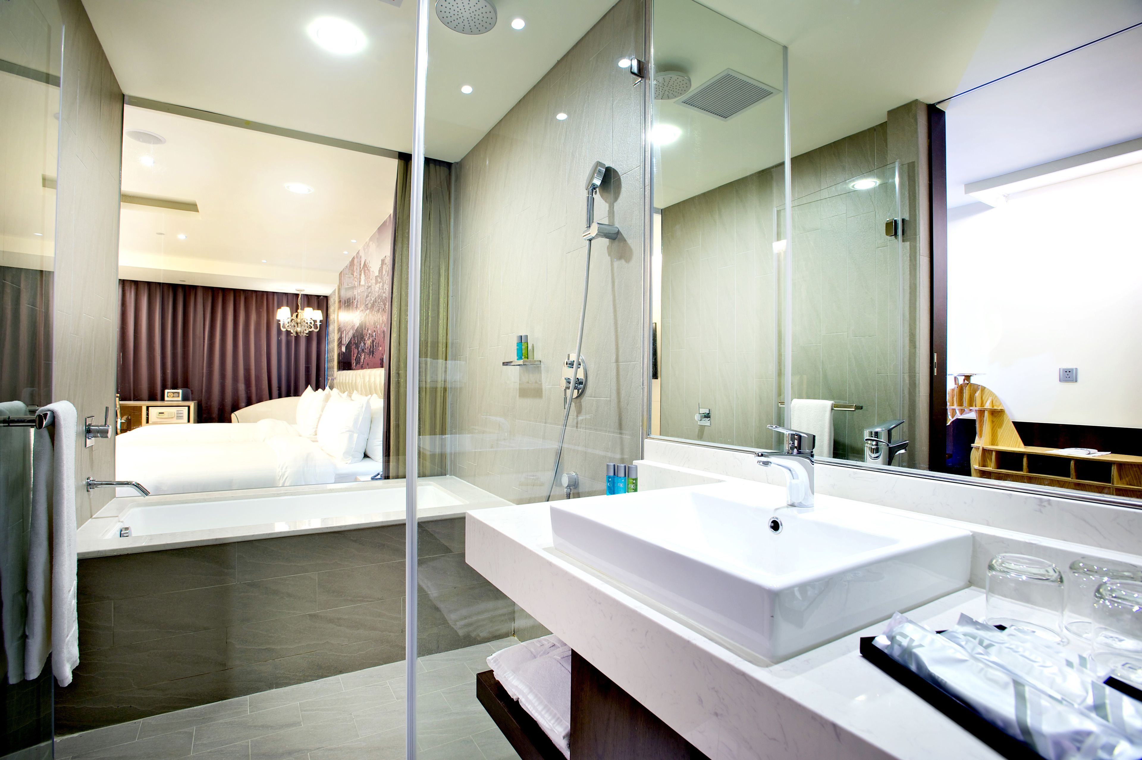 deluxe quadruple room | bathroom | hair dryer, towels