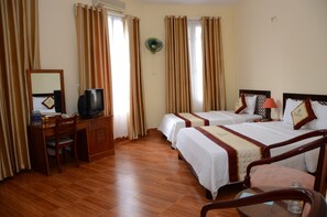 Deluxe Triple Room, City View | Minibar, in-room safe, desk, blackout curtains