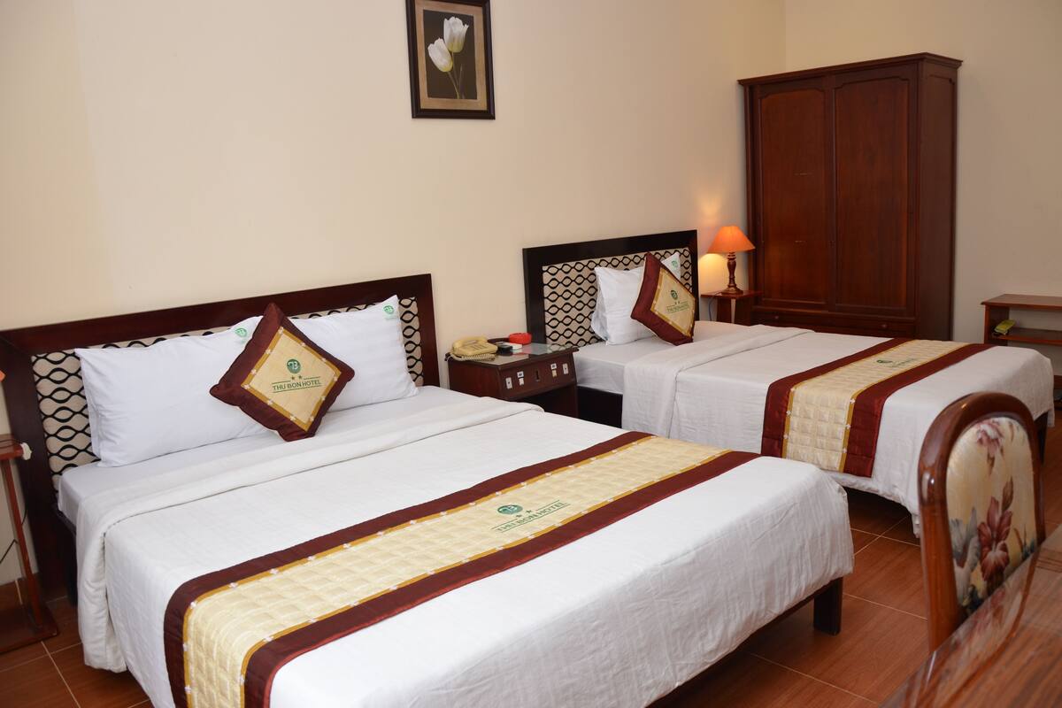 Deluxe Triple Room, City View | Minibar, in-room safe, desk, blackout curtains