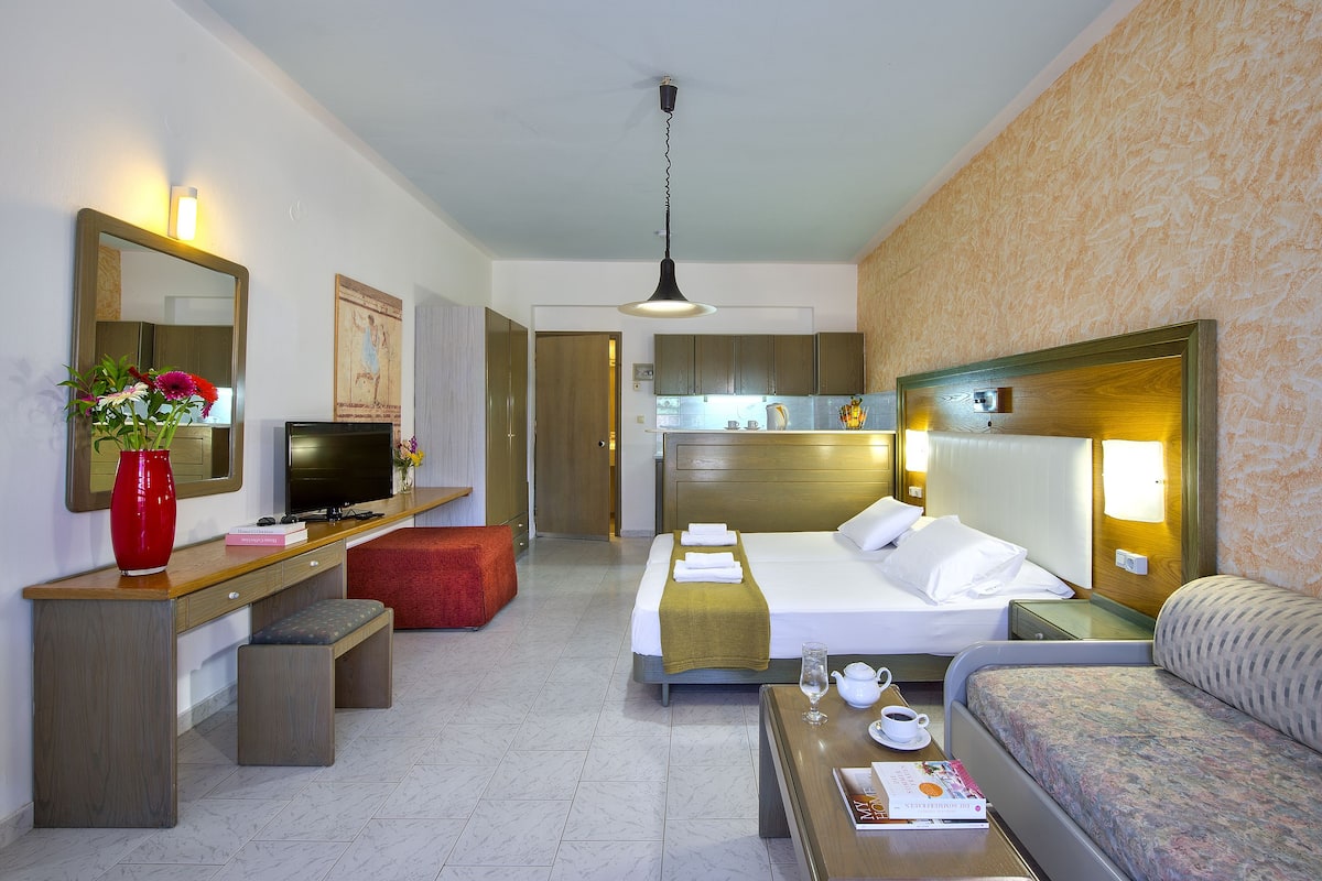 Apartment, 1 Bedroom, Pool View, Ground Floor | In-room safe, soundproofing, iron/ironing board, cribs/infant beds
