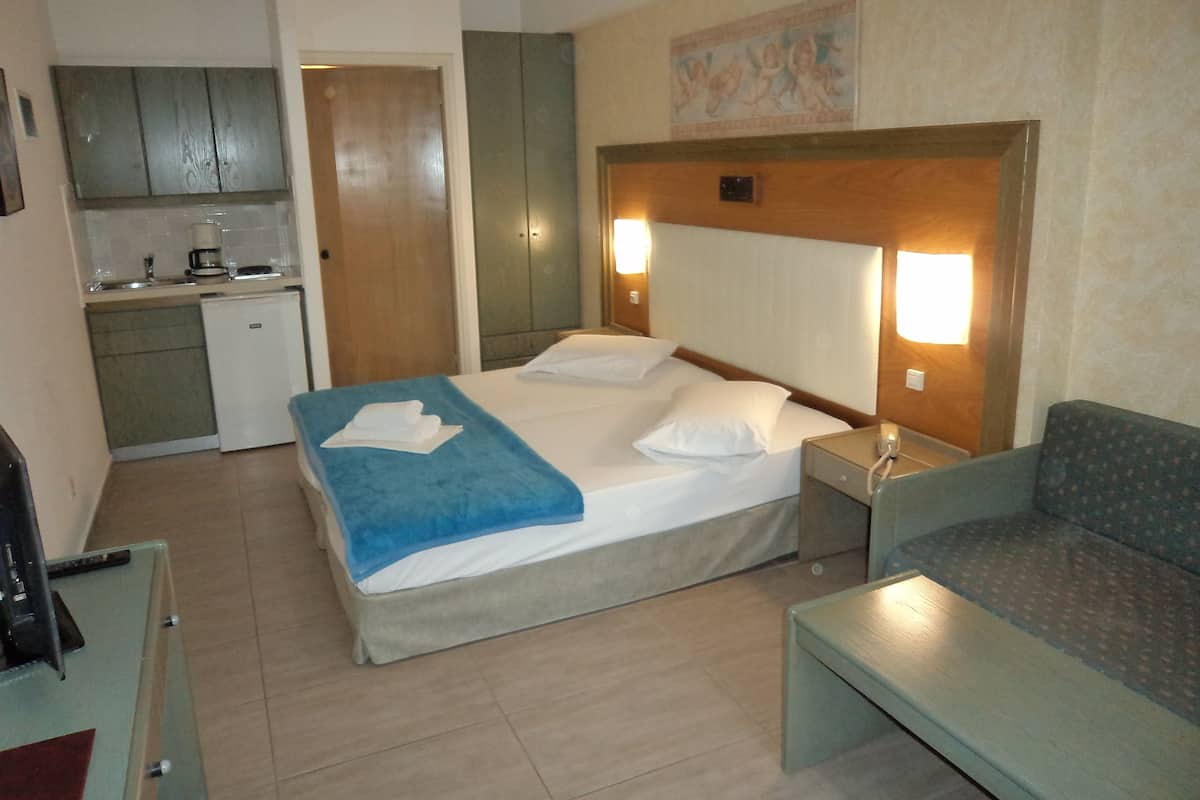 Twin Room, Pool View, Ground Floor | In-room safe, soundproofing, iron/ironing board, cribs/infant beds