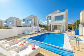 Outdoor pool, pool umbrellas, sun loungers