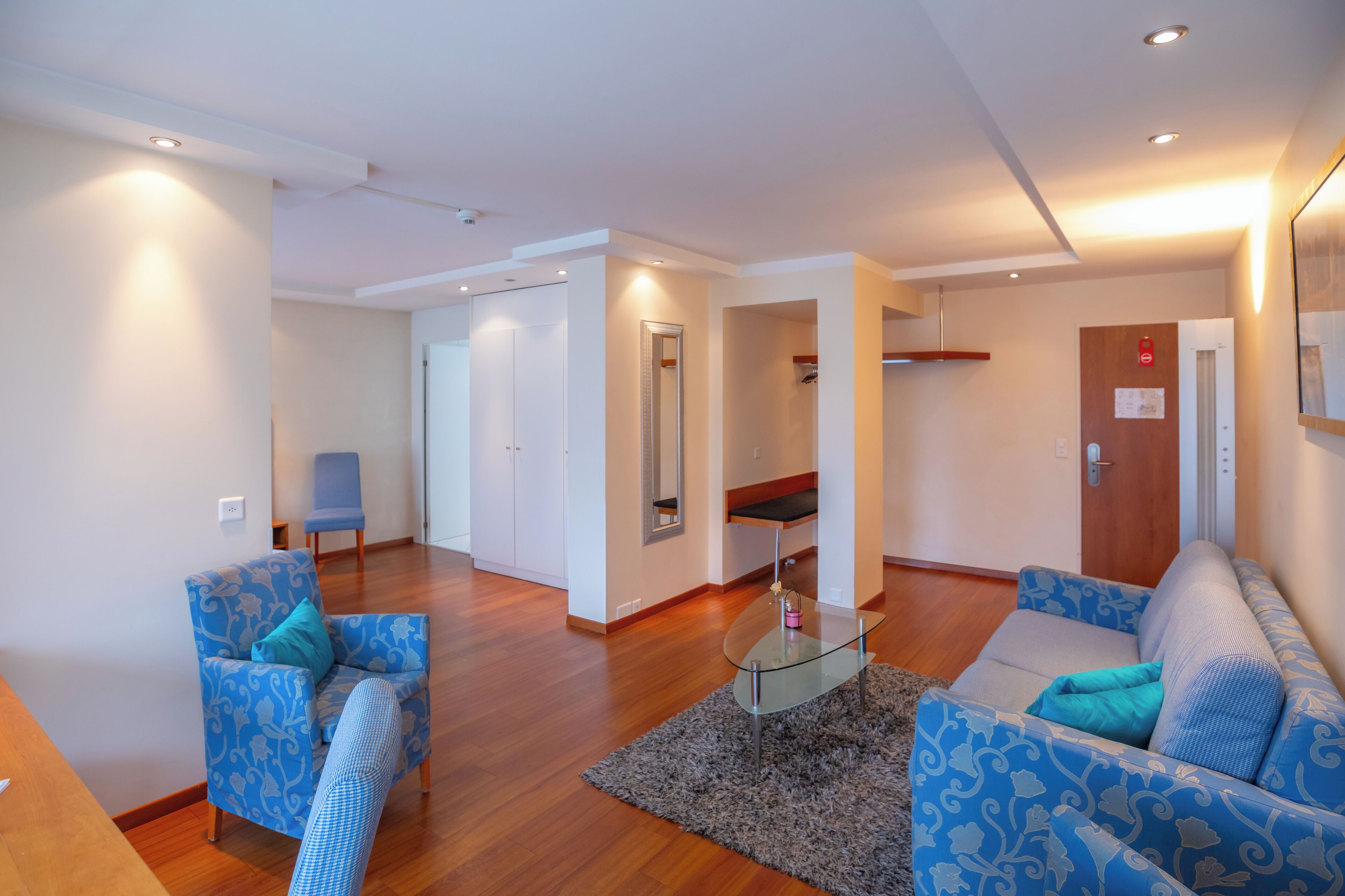 junior suite | living area | flat-screen tv