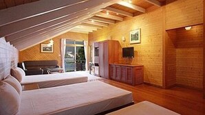 A bedroom with two beds, wooden walls, a ceiling fan, a TV, and a window with a view. - Haoshengdi (Lugu)