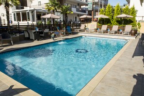 Outdoor pool, open 9:00 AM to 8:00 PM, pool umbrellas, pool loungers