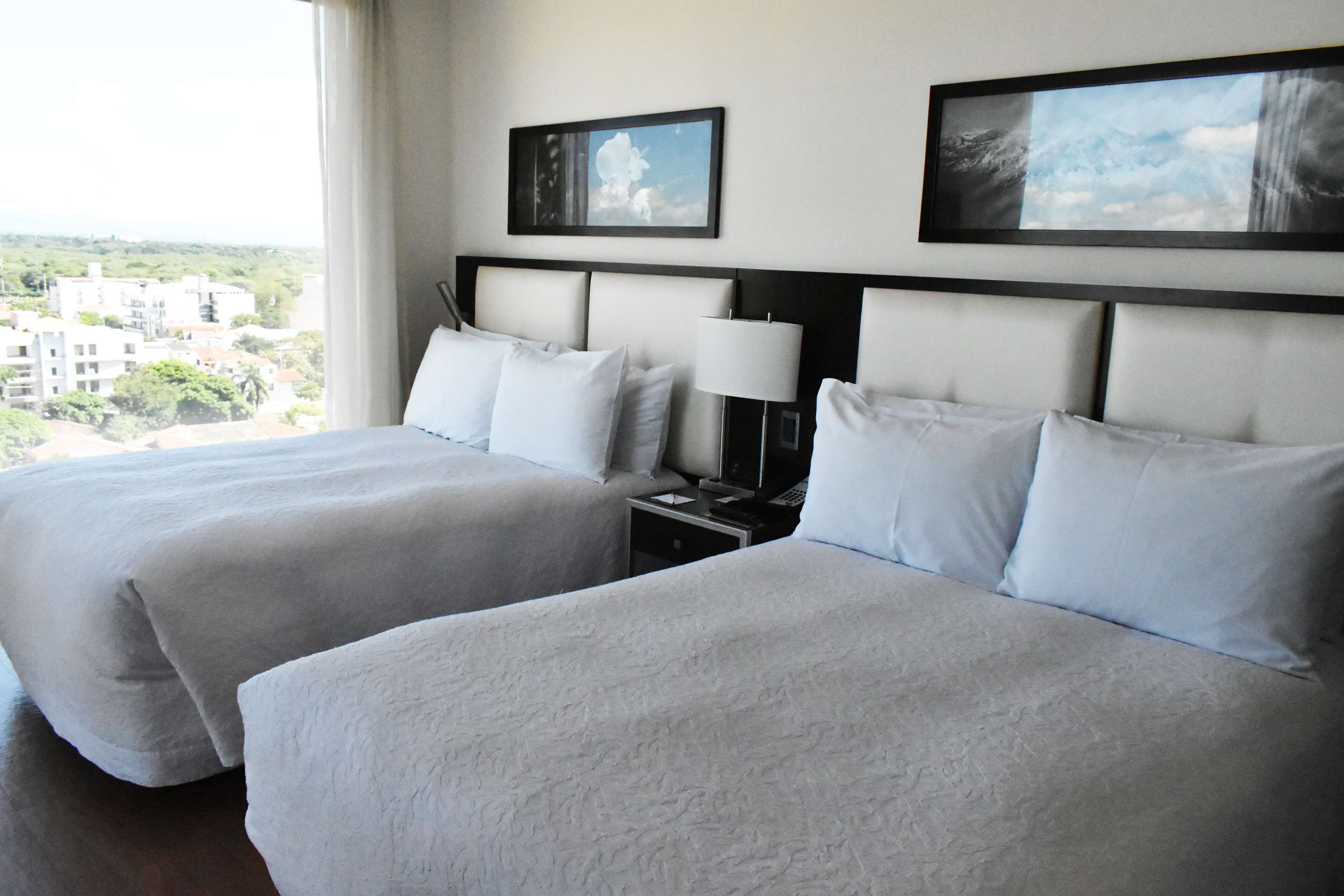 room, multiple beds | in-room safe, blackout curtains, iron/ironing board