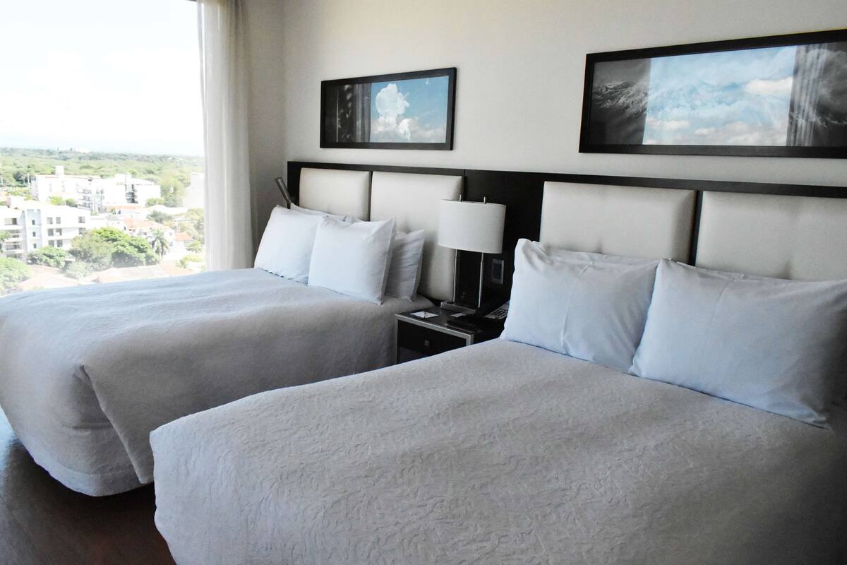 room, multiple beds | in-room safe, blackout curtains, iron/ironing board