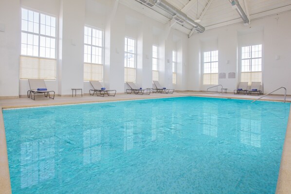 Indoor pool, open 8:00 AM to 10:00 PM, pool loungers