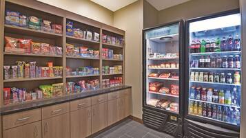 A snack and beverage vending area with various snacks and drinks.