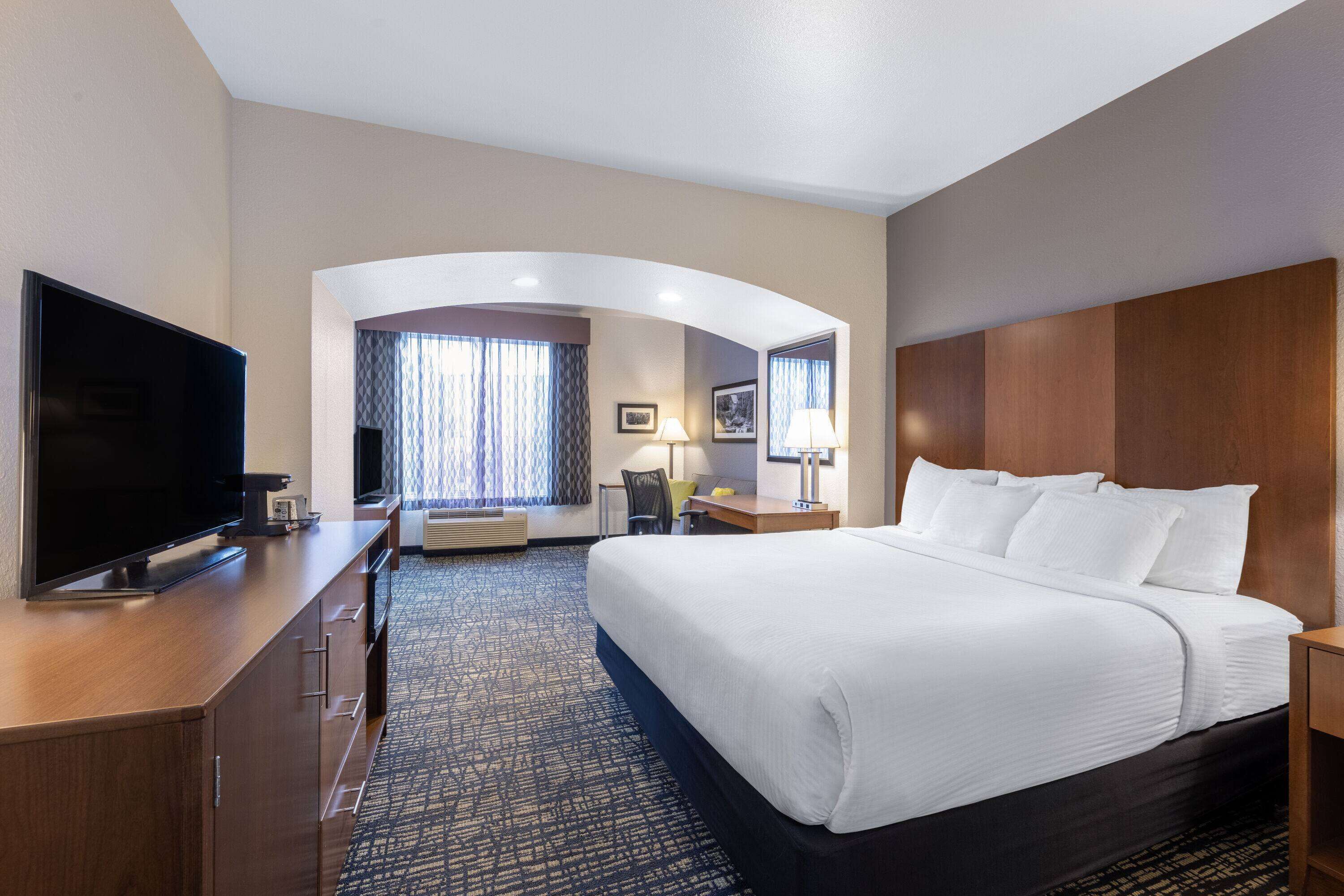 premium bedding, desk, blackout curtains, iron/ironing board