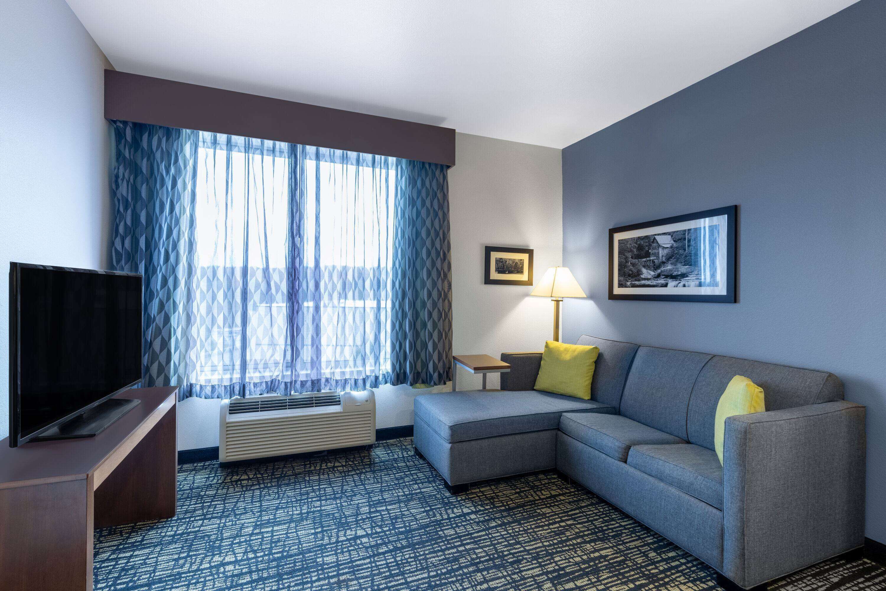 premium bedding, desk, blackout curtains, iron/ironing board