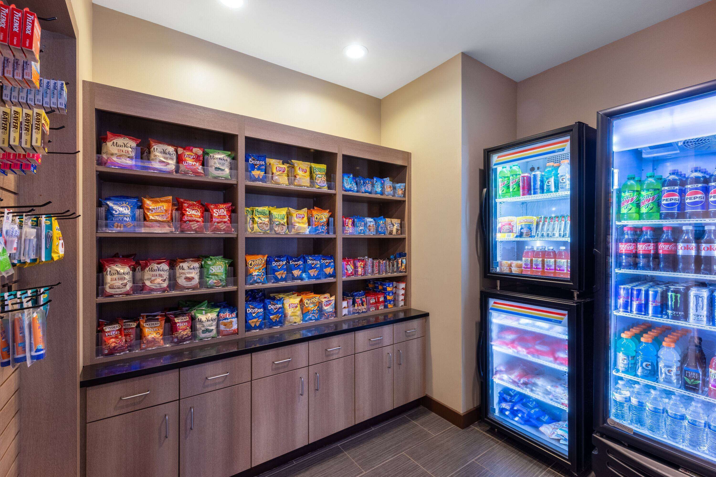A self-service snack and beverage station with various snack options and drinks.
