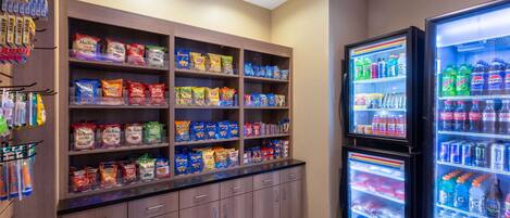 A self-service snack and beverage station with various snack options and drinks.