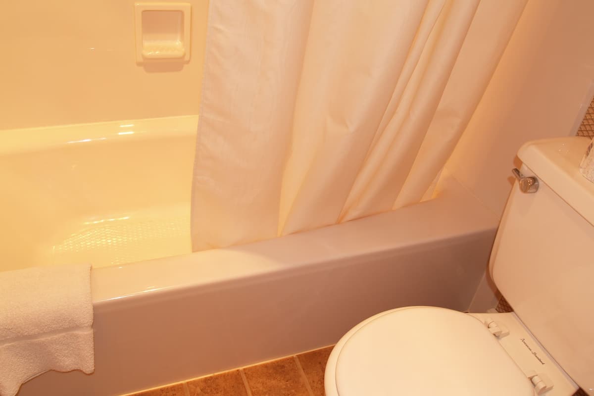 family room | bathroom | combined shower/bathtub, hair dryer, towels