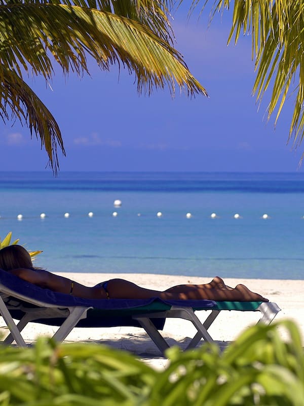 On the beach, sun loungers, beach towels