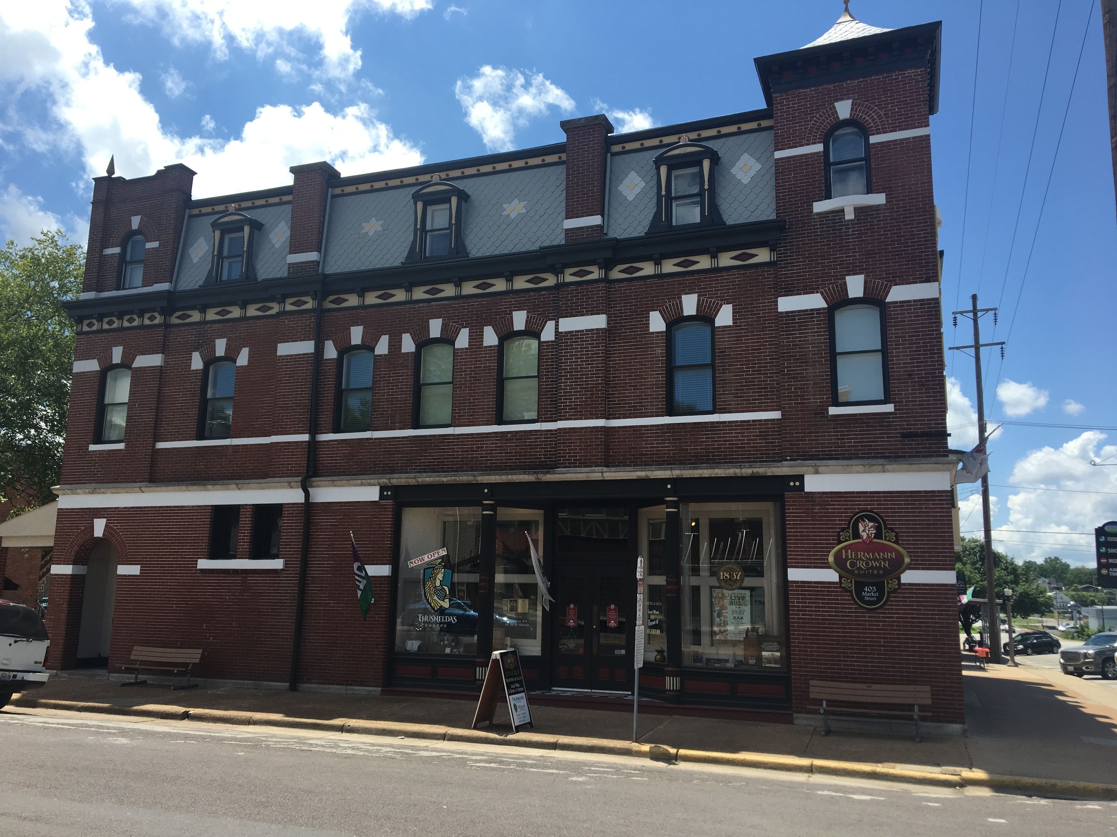 A two-story brick building with a storefront.
