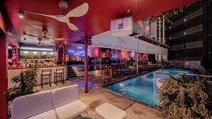 A bar area with seating and a pool. - The Kuala Lumpur Journal (Kuala Lumpur)