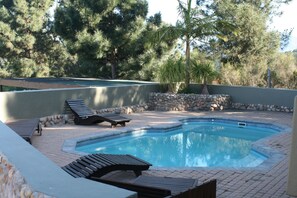 2 outdoor pools, open 7:00 AM to 8:00 PM, pool loungers