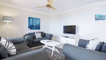 Deluxe Apartment, 3 Bedrooms | Living area | TV