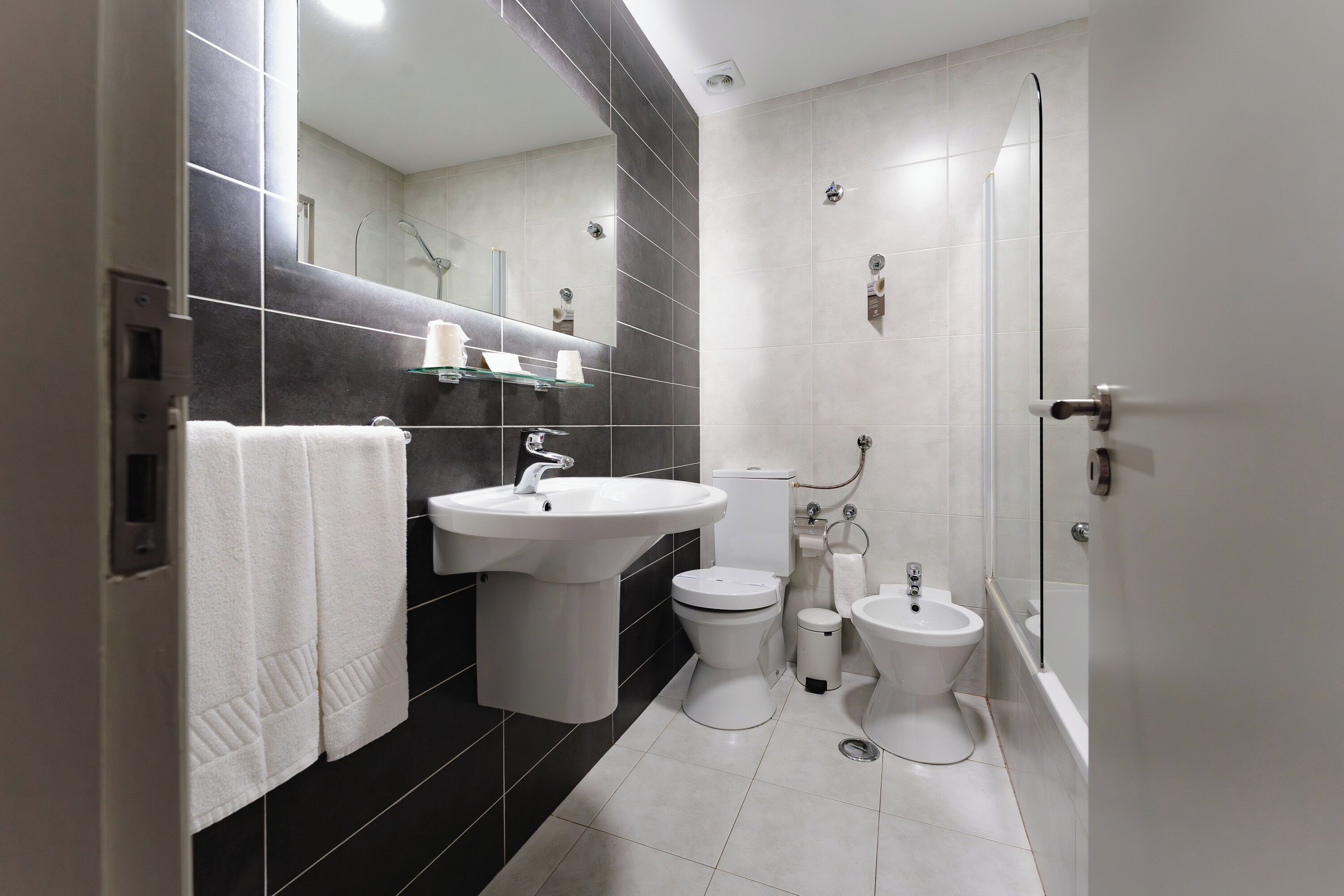 family triple room, multiple beds | bathroom | free toiletries, hair dryer, towels