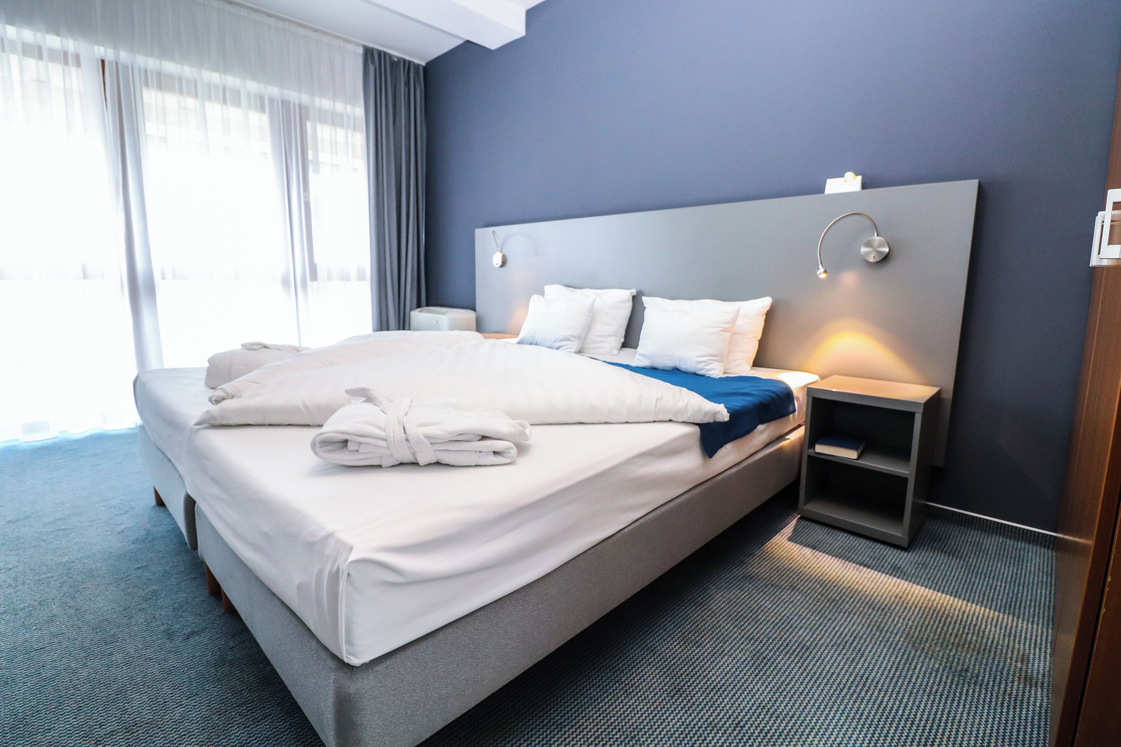 Standard Double Room | Minibar, in-room safe, desk, blackout drapes