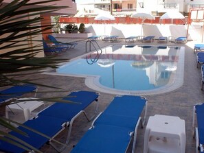 Outdoor pool, pool umbrellas, pool loungers