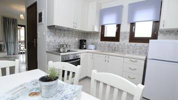 Family Villa, Beachfront | Private kitchen | Full-sized fridge, stovetop, coffee/tea maker, electric kettle