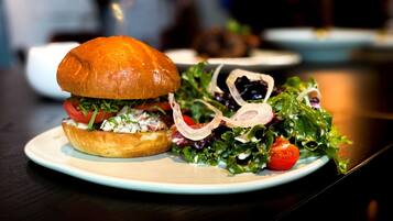 A plate with a sandwich and a salad.