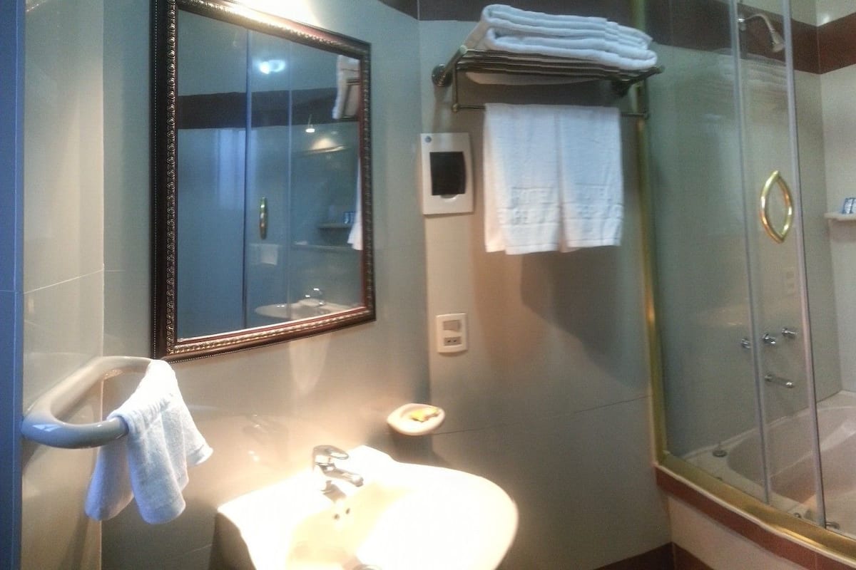 twin room | bathroom | shower, rainfall showerhead, free toiletries, towels