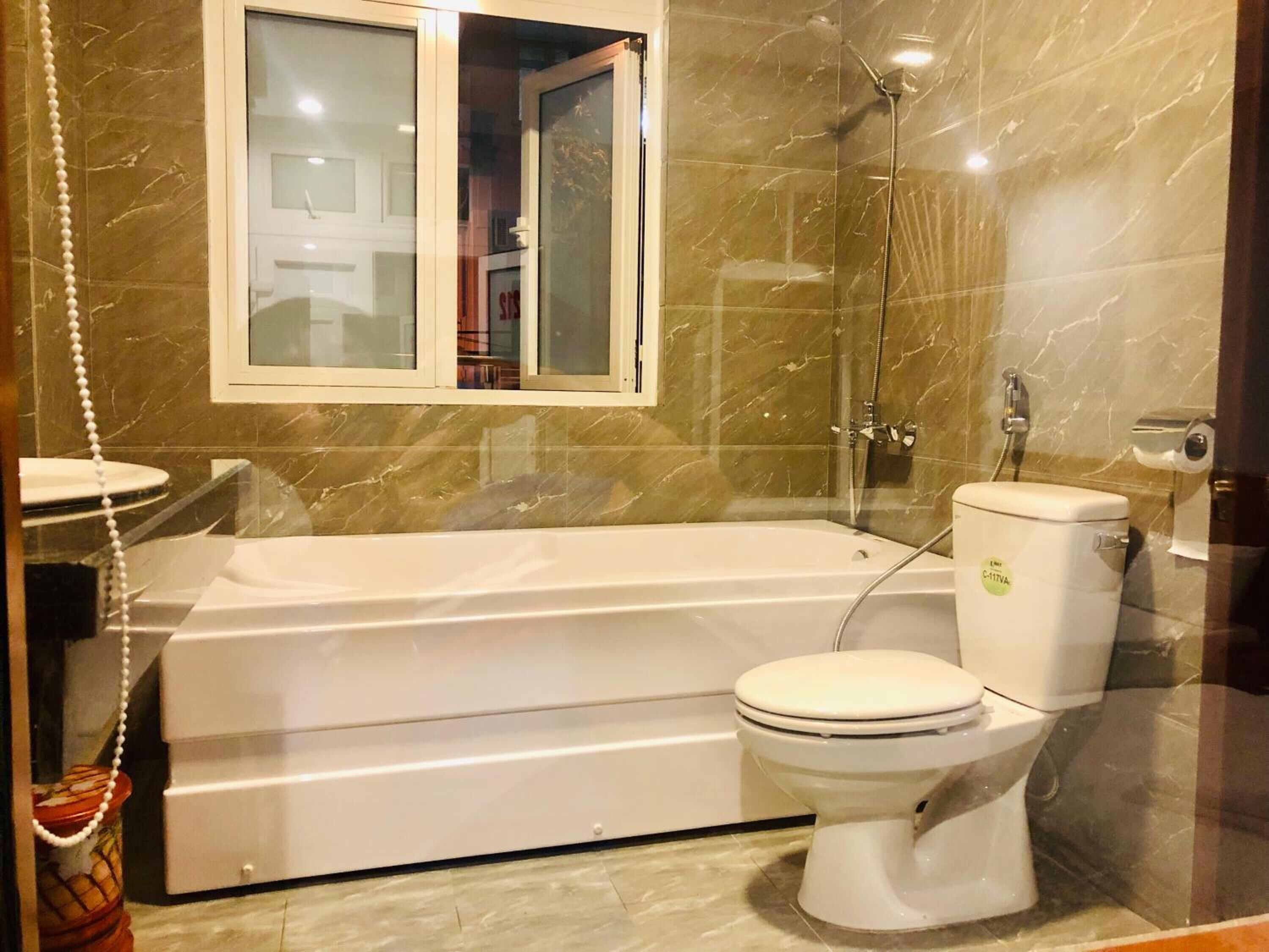 bathtub, free toiletries, hair dryer, slippers