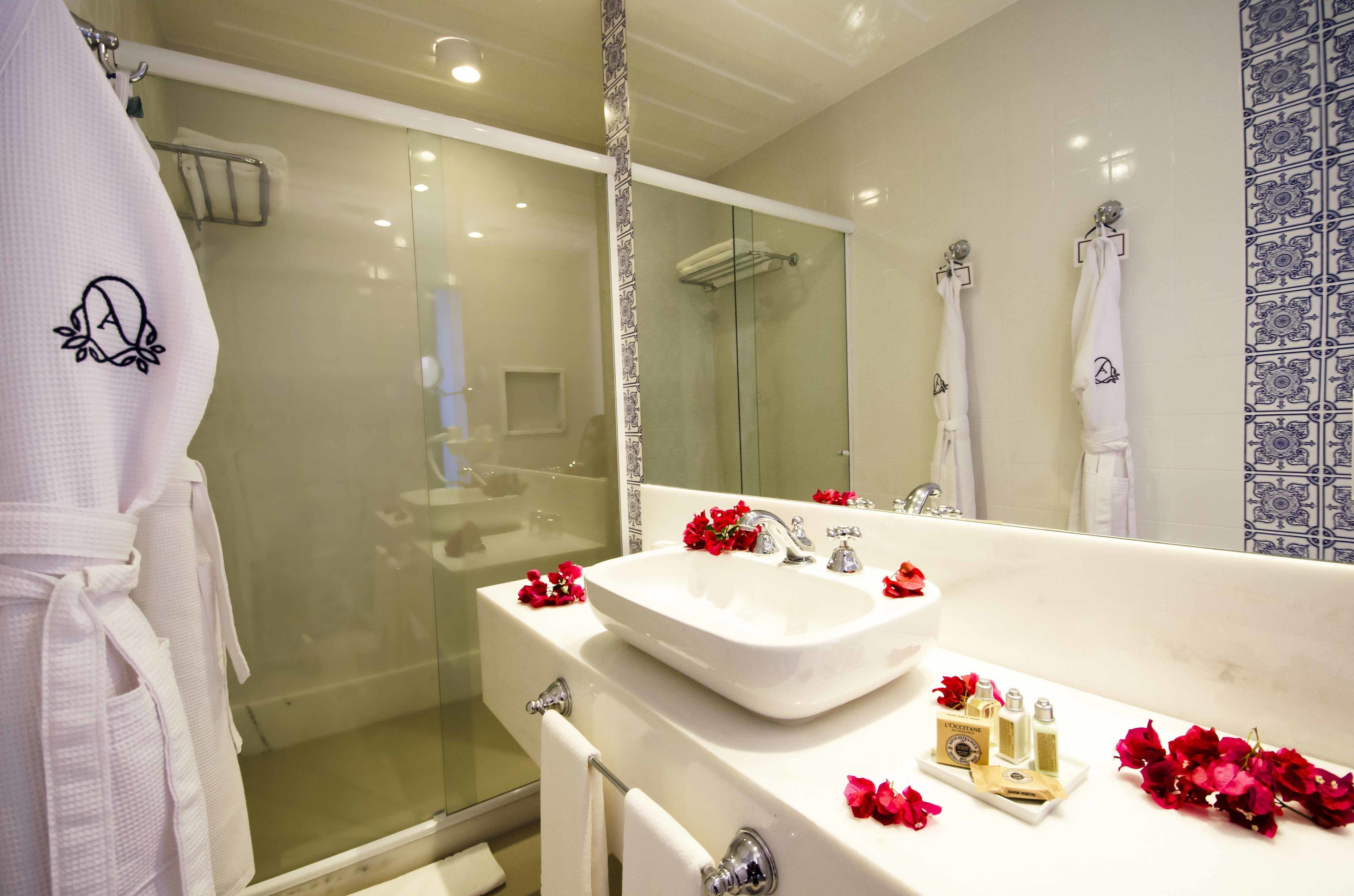 shower, designer toiletries, hair dryer, towels