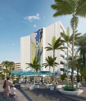 A modern hotel with a large mural on the facade, palm trees, and a covered outdoor area with people. - Abora Buenaventura by Lopesan Hotels (San Bartolomé de Tirajana)