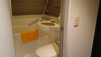 A small bathroom with a toilet, sink, and bathtub.